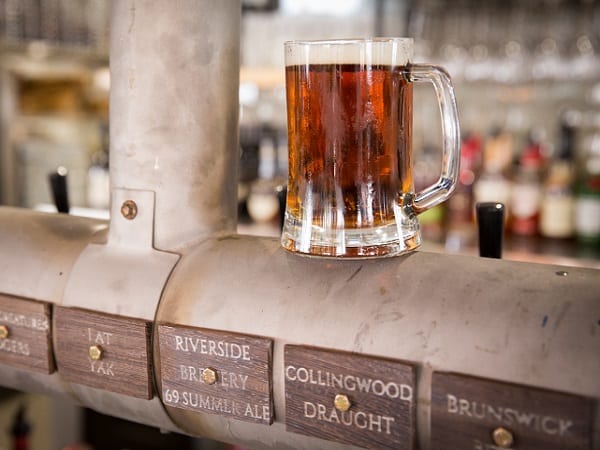 photograph of pint of beer on taps