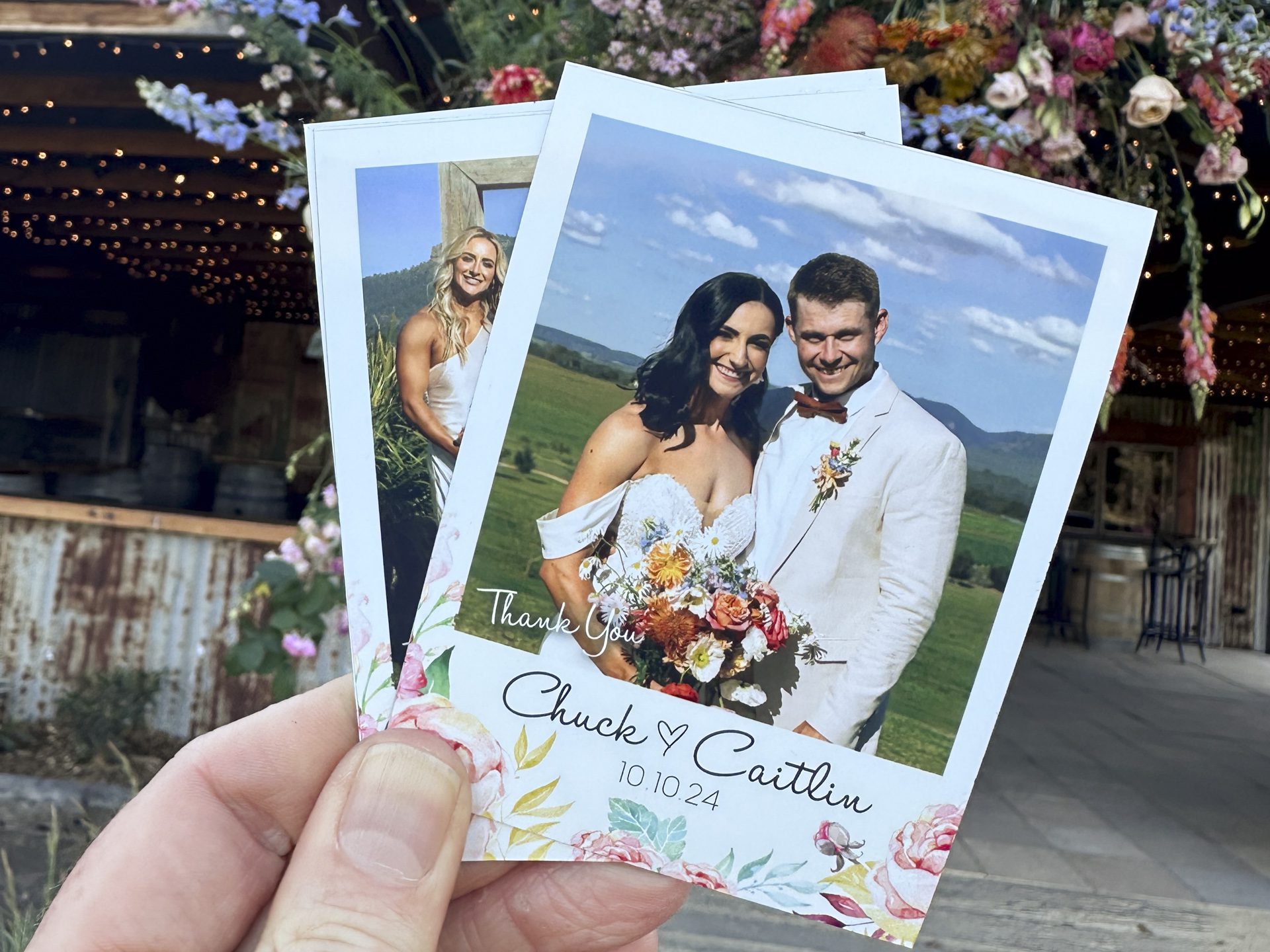 Magnetic Shots wedding magnet-1 hand holding photo magnets in front of flowers